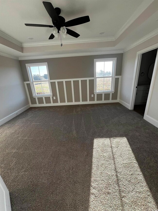 Unfurnished room featuring plenty of natural light
