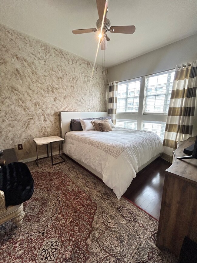 Bedroom featuring wood finished floors and a ceiling​​‌​​​​‌​​‌‌​​‌​​​‌‌​​​​​​‌‌‌​​‌​​‌‌​​​‌ fan