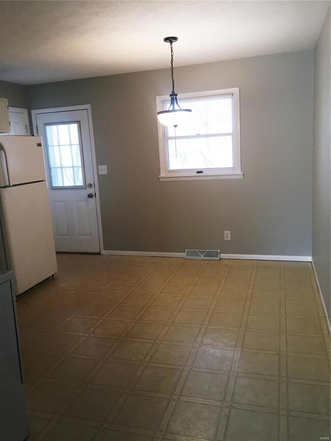 Fresh paint, pantry in kitchen, and exit to outsid