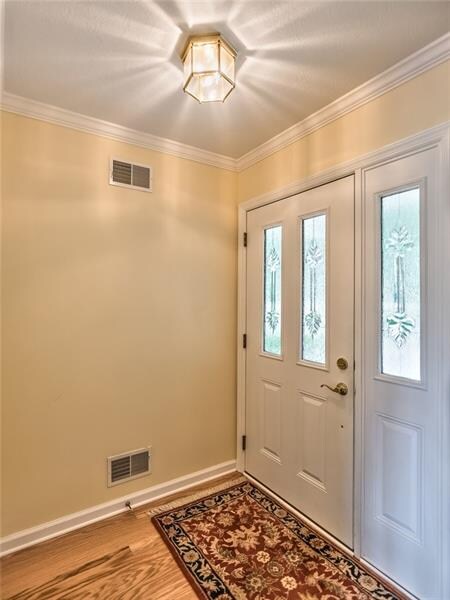 Foyer leads to open floor plan and has nice coat c