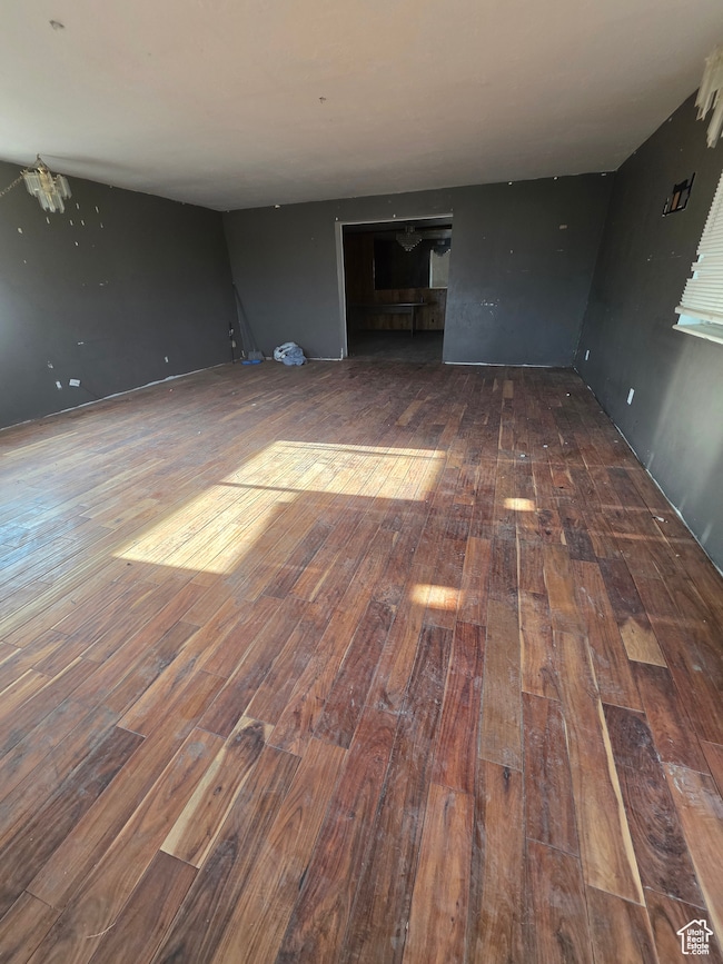 Unfurnished living room featuring hardwood / wood-style floors