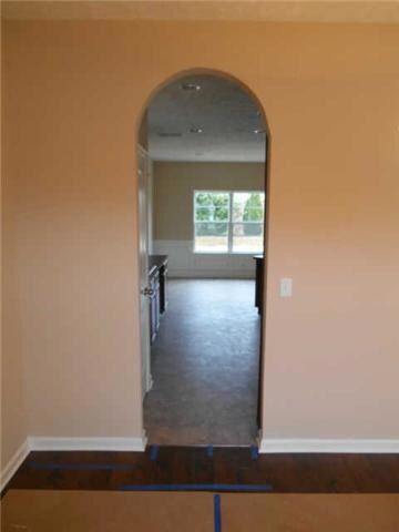 arch opening from Formal Dining Room to kitchen