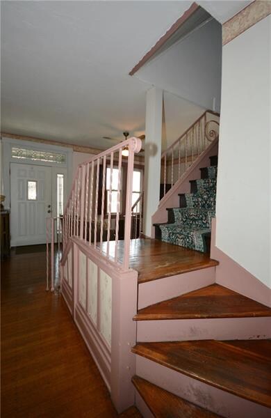 Stairs to the upper level are accessible from both
