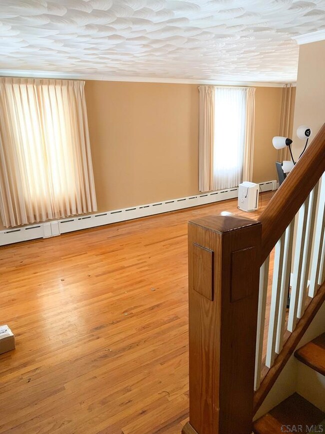Large living room with beautiful hardwood
