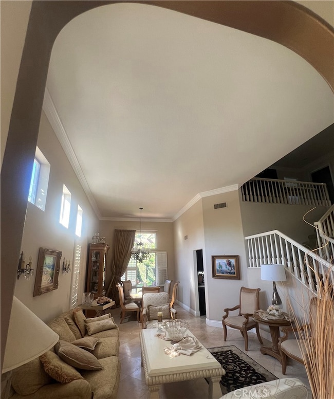 two high ceiling living rooms