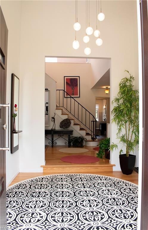 Vaulted entry with hardwood floors