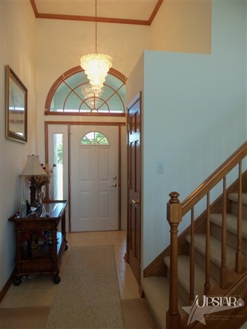 Foyer Entry has a Soaring Ceiling, Circle-Top Wind
