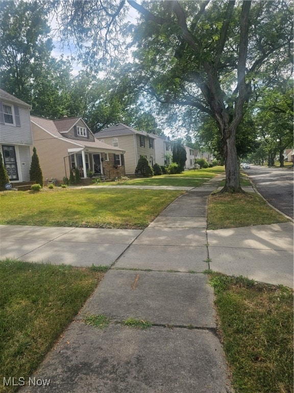 View of front of house featuring covered porch and a front lawn