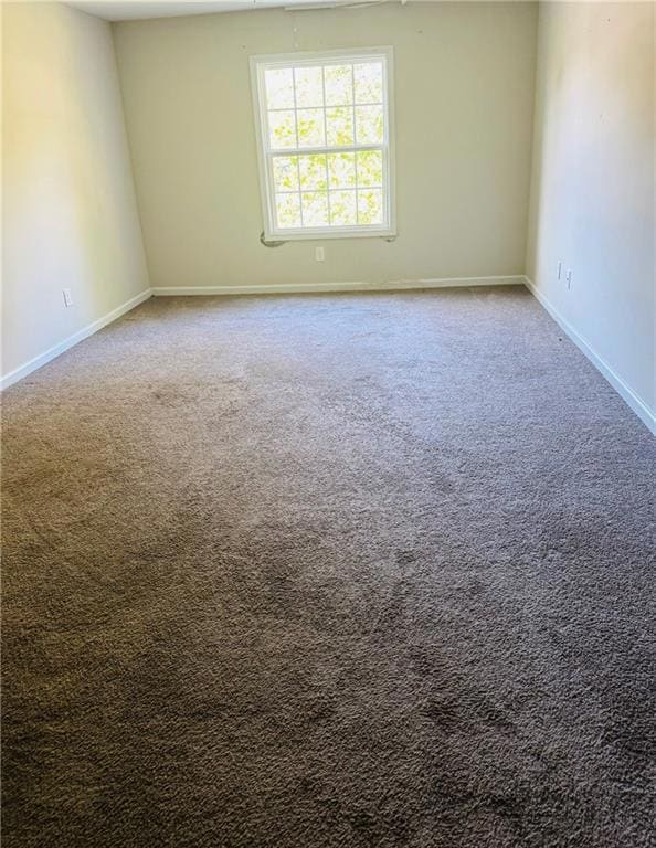 Empty room with carpet floors