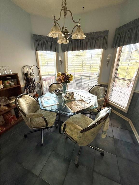 Eat-in kitchen area with bay window and a chandelier