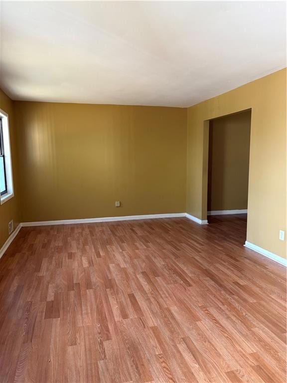 Empty room with light wood-style flooring