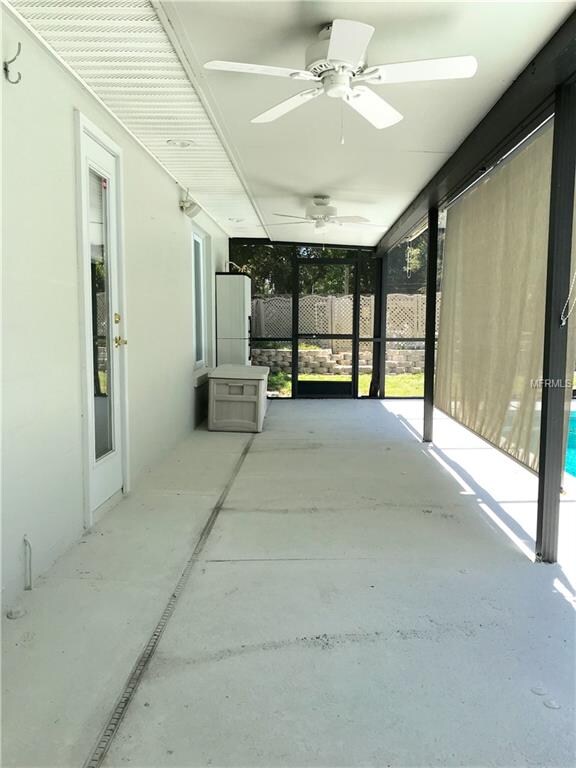 Pool deck leading to house.