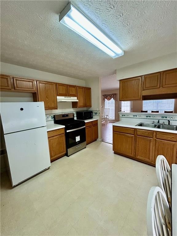 Kitchen with freestanding refrigerator, stainless 