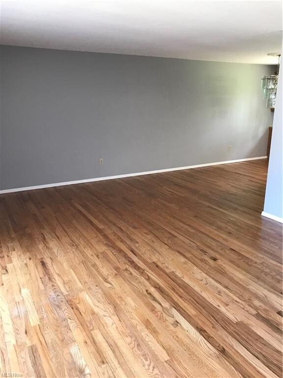 L-shaped Living Rm to Dining Rm with wood floors