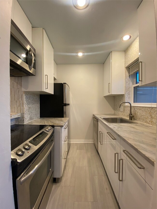 Updated kitchen with brand granite countertops.