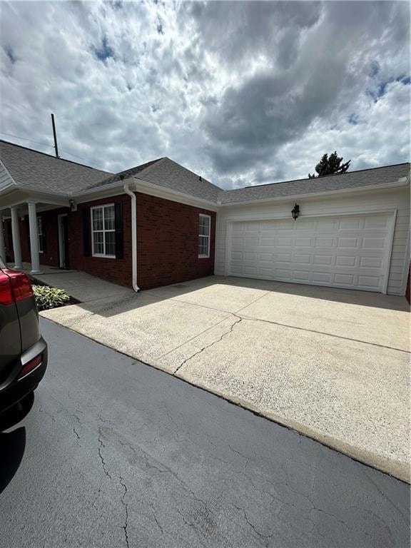 View of home's exterior featuring brick siding, co