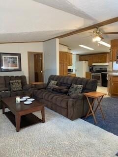 Spacious living room blends directly into kitchen and dining room.  Primary bedroom ensuite doorway directly behind.