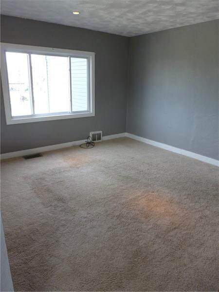 Living Room- Neutral Carpet & Grey toned walls