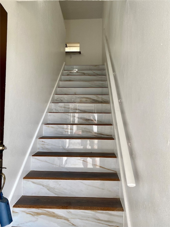 These beautiful stairs with Custom tile and wood t