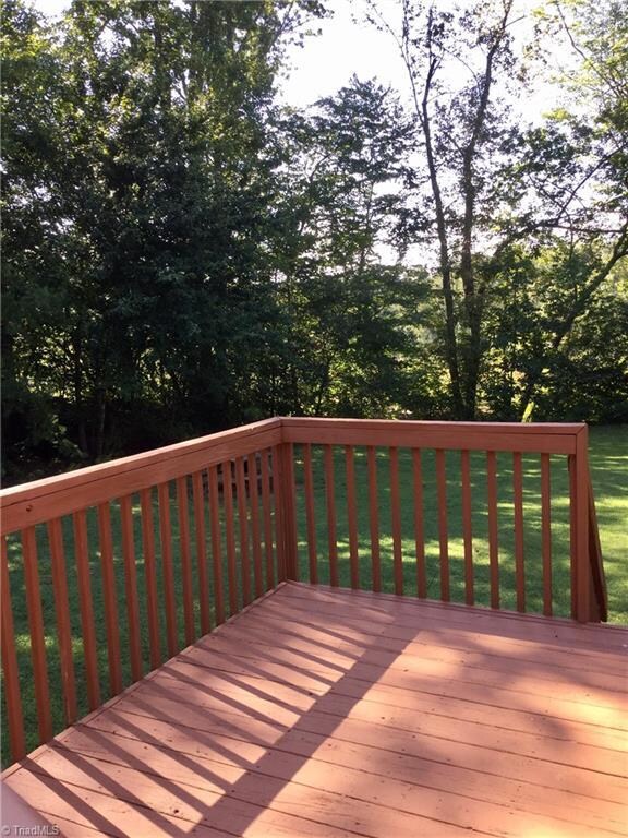 Back deck with an awesome back yard.