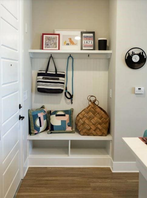 Mudroom with dark hardwood / wood-style flooring
