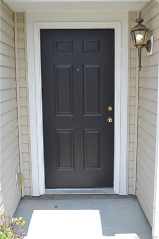 Front stoop with freshly painted door.