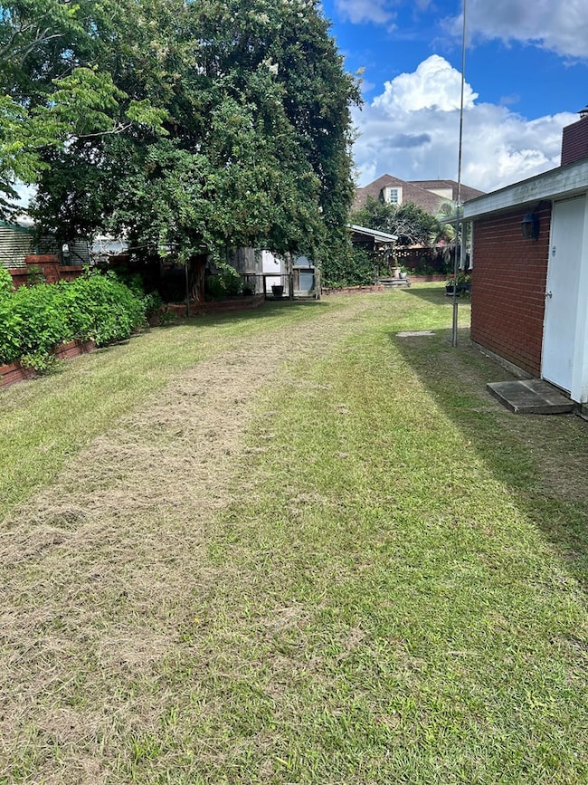 SIDE OF BRICKED IN FIRST YARD