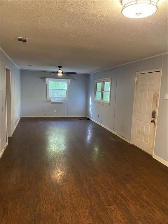Empty room featuring plenty of natural light, wood