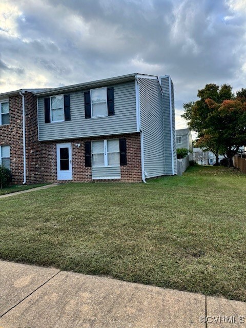 View of front of property with a front lawn