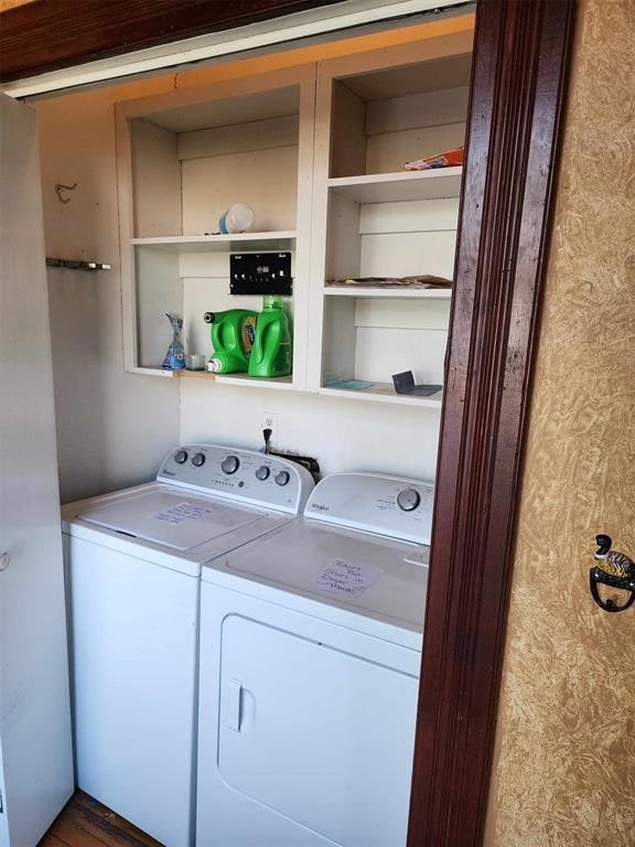 Washroom featuring washer and dryer