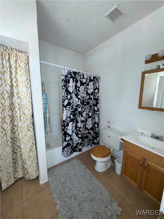 Full bathroom featuring tile patterned flooring, s