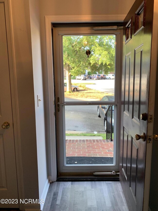 Looking out front door to parking