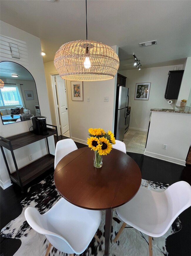 Dining space with arched walkways and baseboards