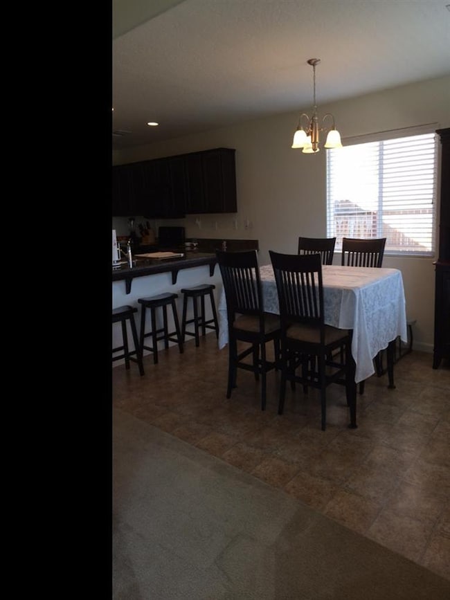 Beakfast bar opens to the dining room makes an ide