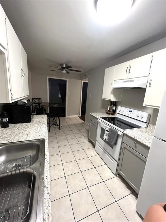 Kitchen with white appliances, under cabinet rang
