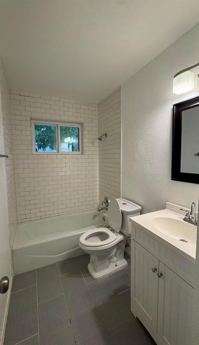 Full bathroom featuring tile patterned floors, va