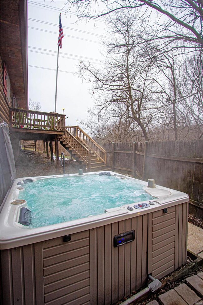 Your new private hot tub has a waterfall feature and built in radio with pop up speakers to name a few bells and whistles!