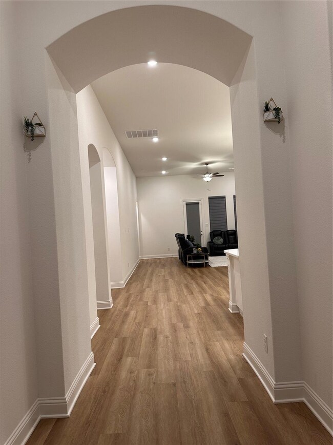 Hall featuring light wood-type flooring