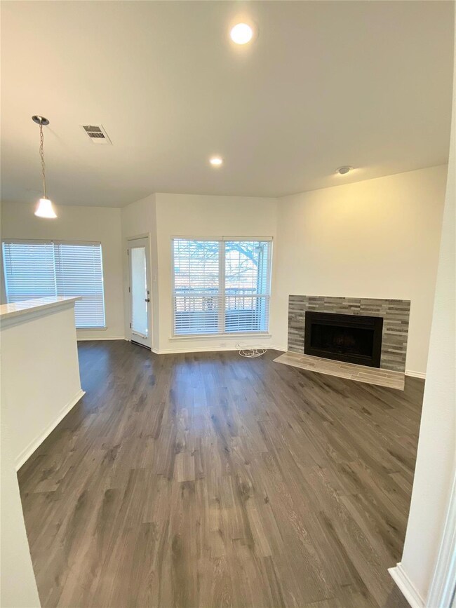 Cozy living space with accent fireplace. View out 