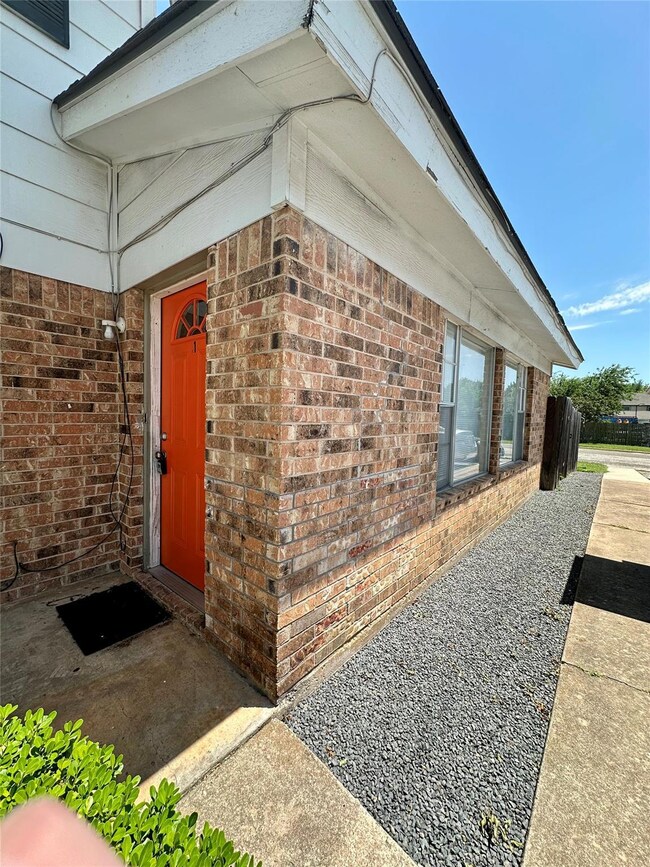 View of side of property with brick siding