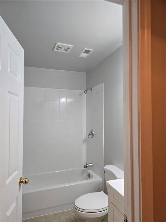 Bathroom with toilet, vanity, shower / bathtub combination, and tile patterned floors