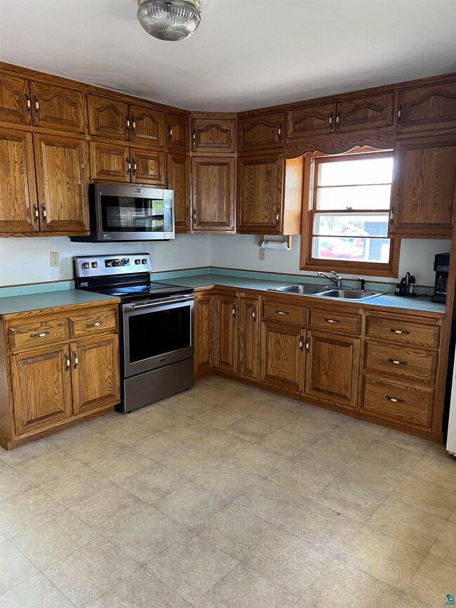 Kitchen featuring stainless steel appliances, sink