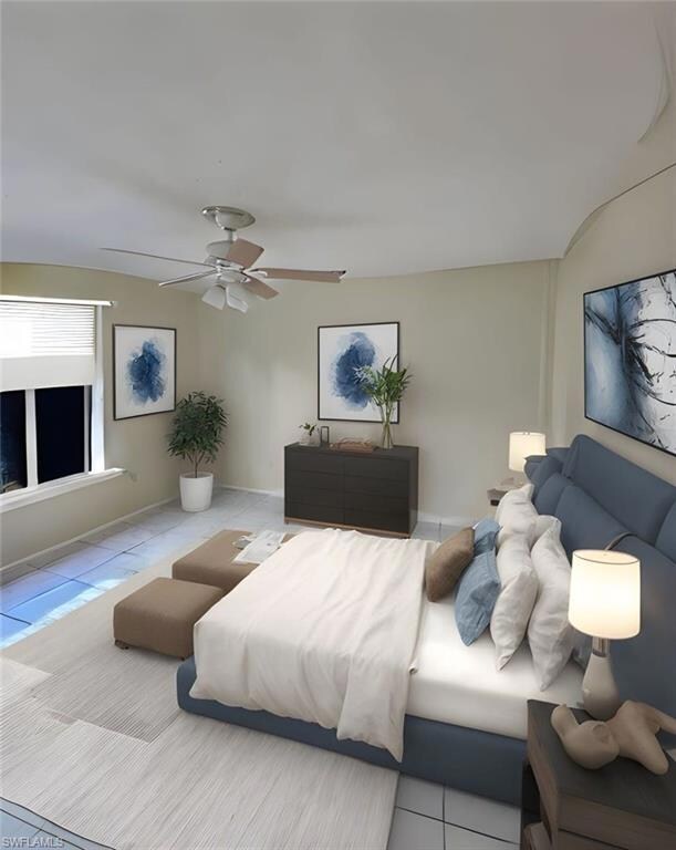 Bedroom with tile patterned floors and a ceiling fan