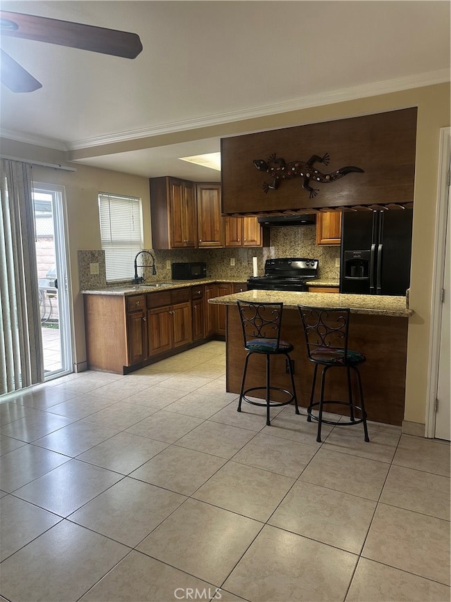 Lovely Kitchen features ample cabinets for storage and Granite Countertops