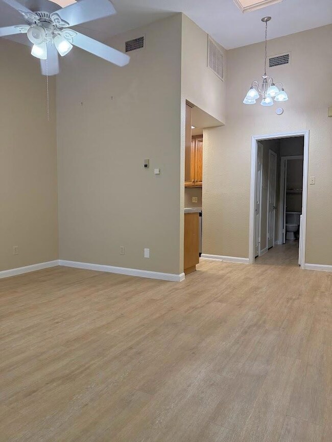 Unfurnished room featuring a chandelier, a ceilin