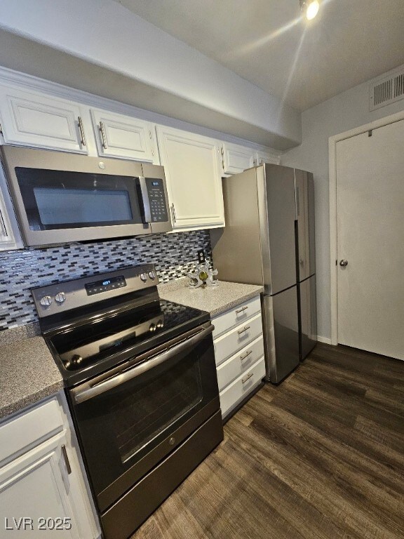 Kitchen , white cabinets, backsplash, and applianc