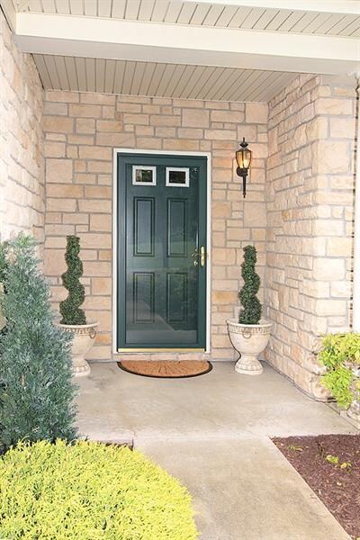 PRETTY STONE FRONT AND MANICURED LANDSCAPING