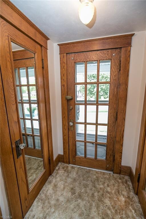 Charm hits you from the minute you walk in with the beautiful woodwork and dual front hall closets with mirrored insets.