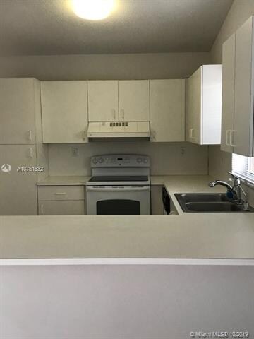 Kitchen counter right by family room.  Ample room for 4 kitchen stools