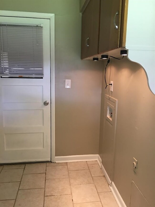 Laundry off kitchen by the door to the 1 car garag